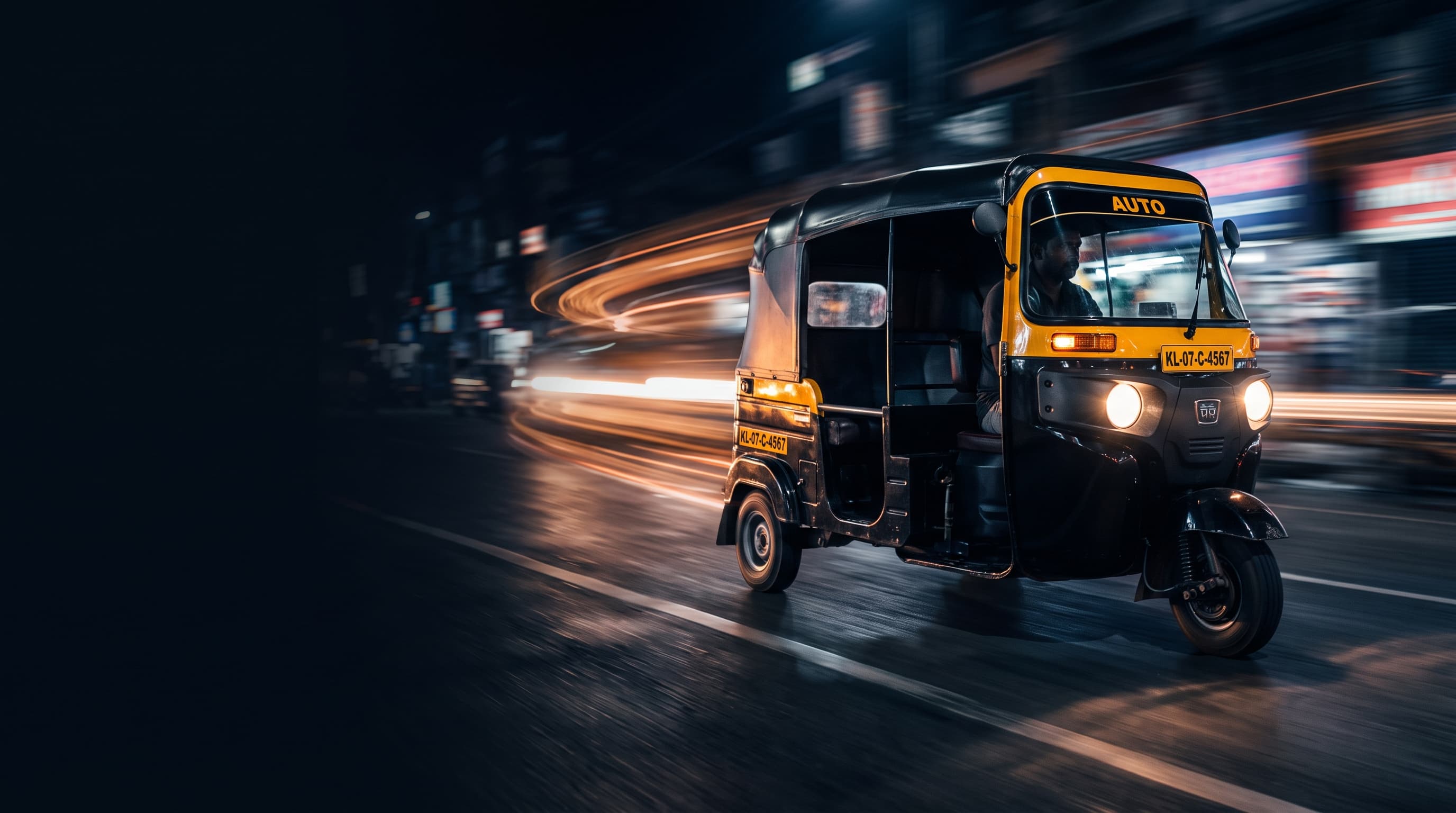 Neptune three-wheeler driving at night